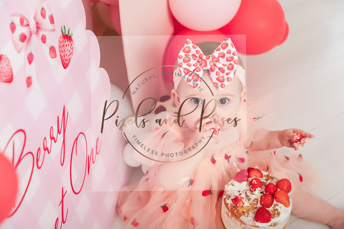 Berry Sweet One cake smash first birthday photoshoot with strawberry themed styling in Derbyshire studio