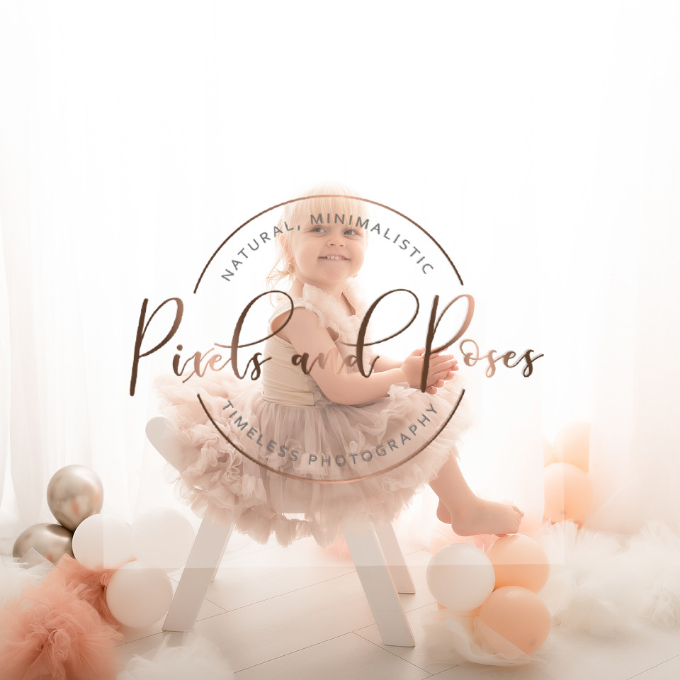 Pastel pink first birthday portrait photography before cake smash begins