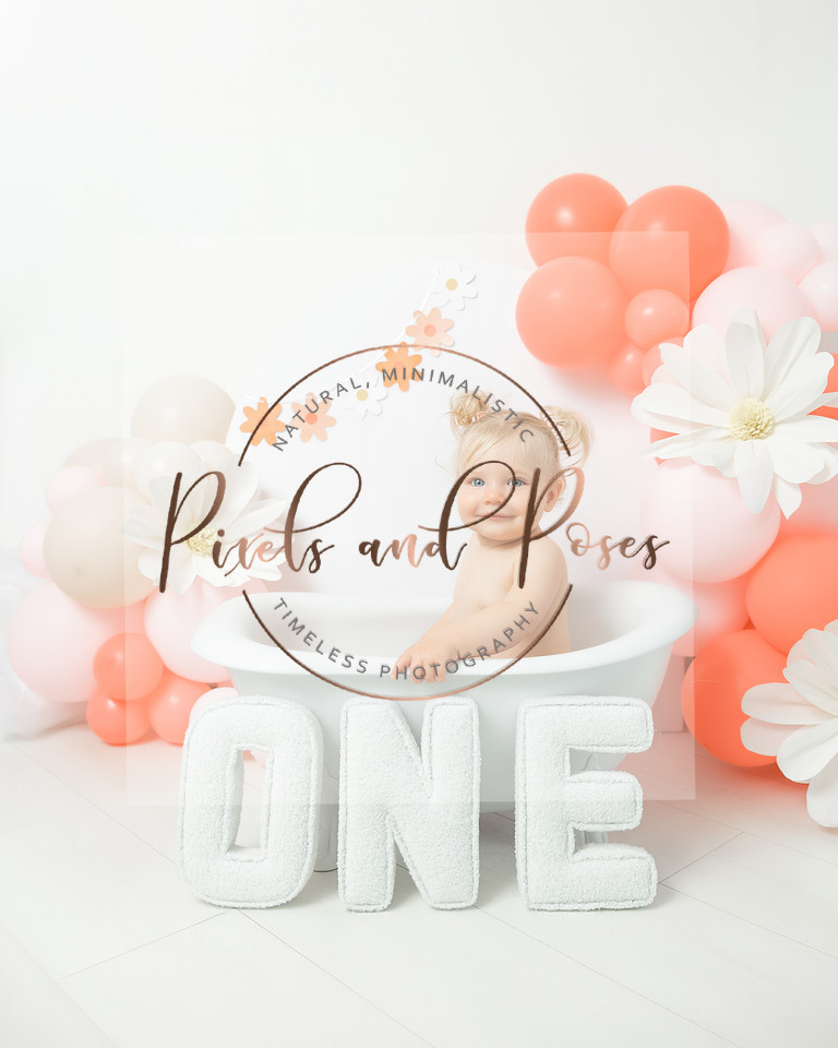 Daisy pink cake smash first birthday photoshoot in Derbyshire studio