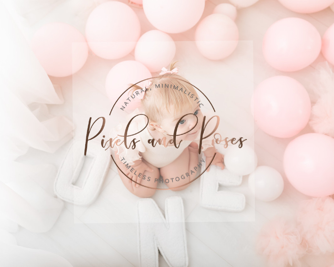 Pink balloon cake smash photography setup for baby girl first birthday