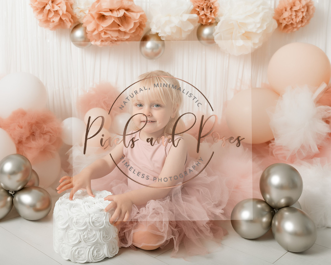 Pom Pom pink cake smash first birthday photoshoot in Derbyshire studio