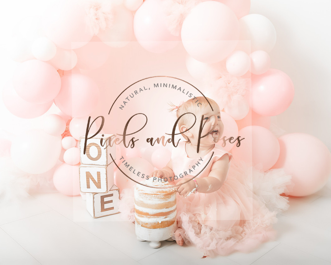 Pastel pink cake smash first birthday photoshoot in Derbyshire studio