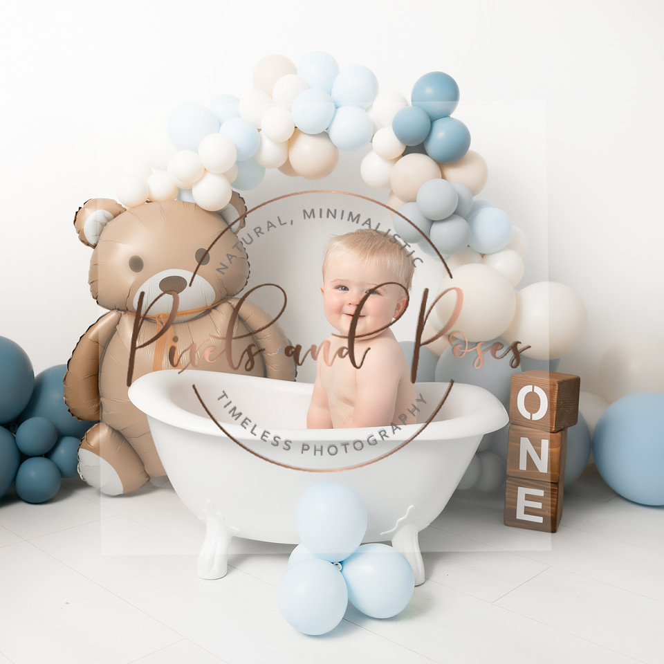 Bearly One teddy bear themed cake smash photography with blue balloons and neutral styling