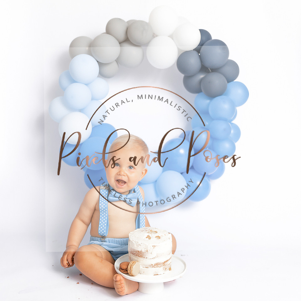 Blue and white balloon cake smash photography for first birthday boy