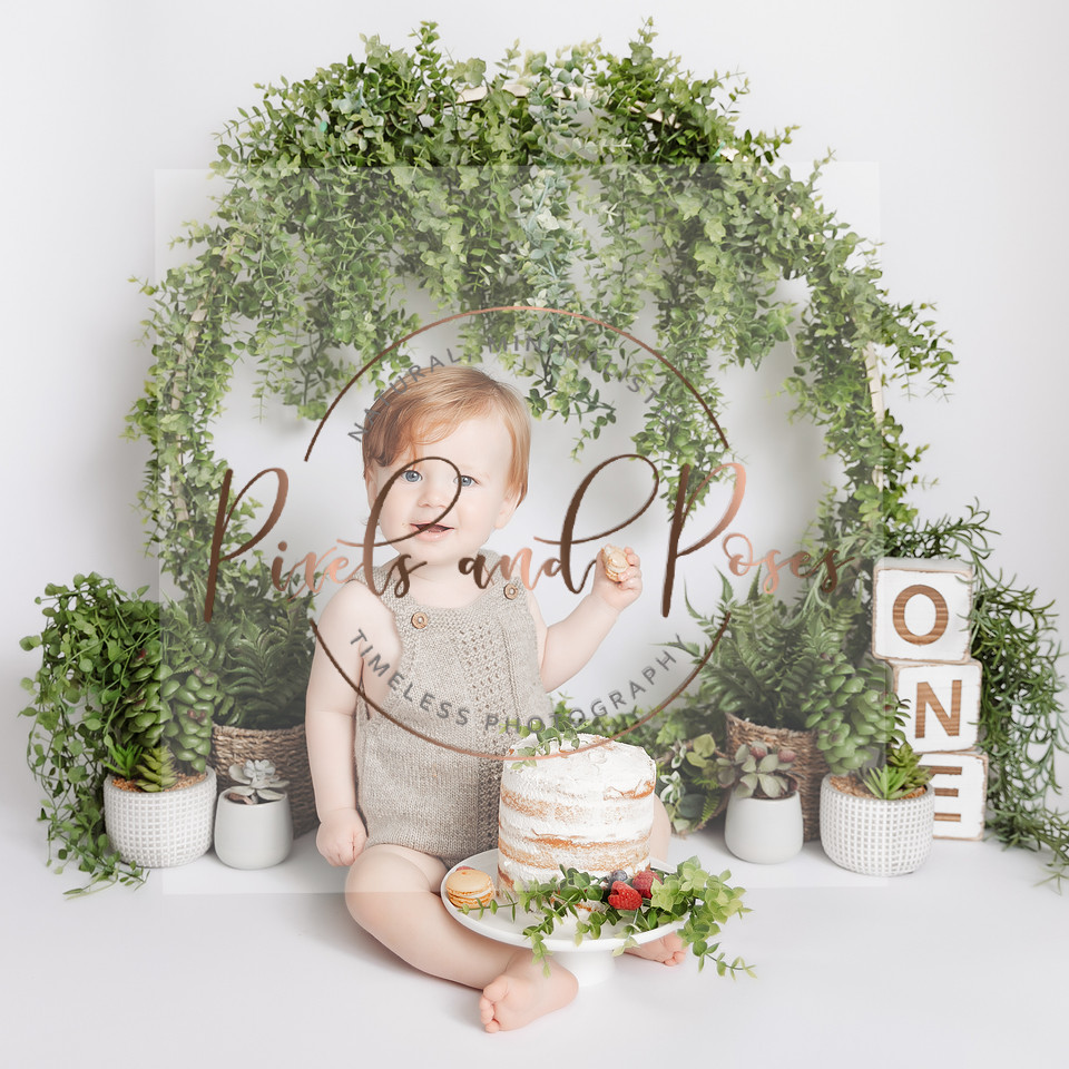 Pretty greenery and foliage styling for a relaxed first birthday cake smash session.