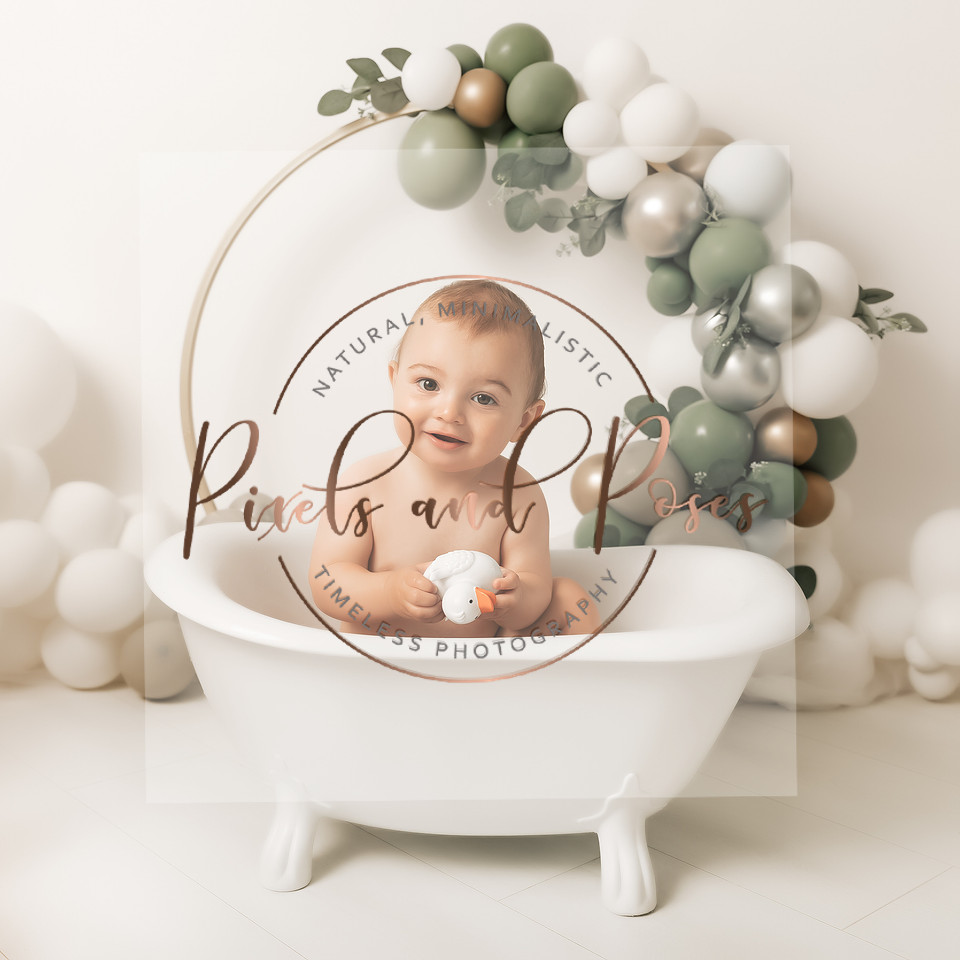 Sage eucalyptus balloons and foliage cake smash setup for first birthday photography